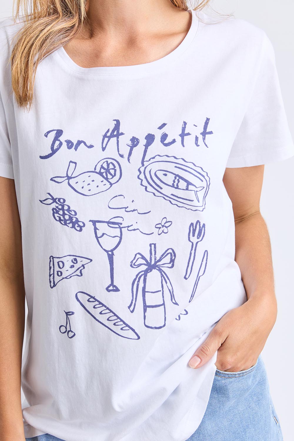 A model wearing the Bon Appetit Cotton Tee in colour White (White), from the front, cropped image