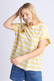 A model wearing the Maddison Cotton Tee in colour Banana, from the front, cropped image