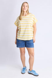 A model wearing the Maddison Cotton Tee in colour Banana, from the front, showing the whole outfit