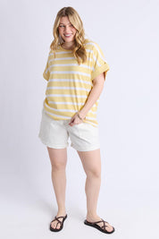 A model wearing the Maddison Cotton Tee in colour Banana, from the front, showing the whole outfit