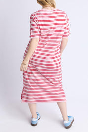 A model wearing the Bon Bon Cotton Dress in colour Redpink, from the back