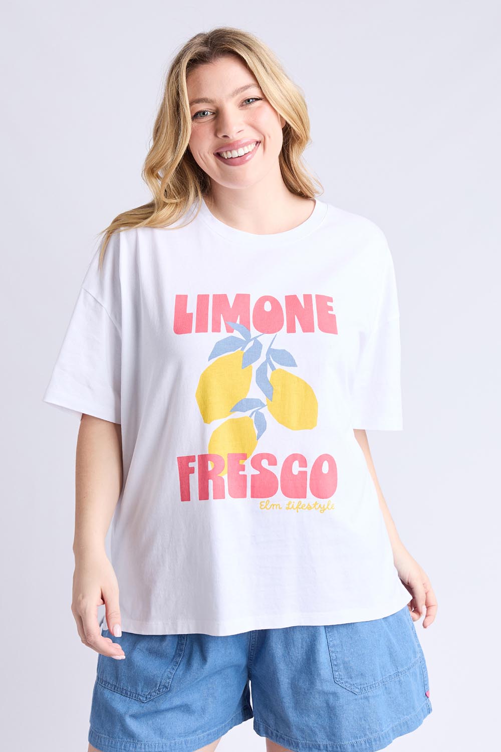 A model wearing the Limone Fresco Cotton Tee in colour White (White), from the front, cropped image