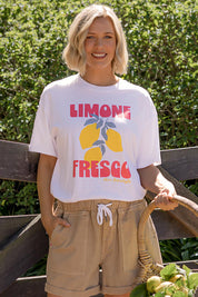 A model wearing the Limone Fresco Cotton Tee in colour White (White), from the front, showing the whole outfit