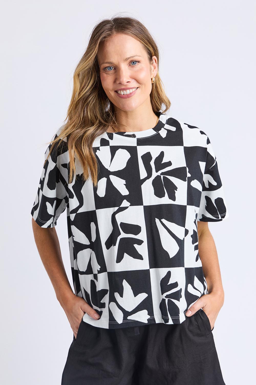 A model wearing the Splice Cotton Tee in colour Blackwhite, from the front, cropped image