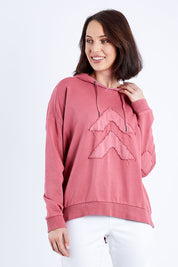 Model Andrea wearing size 10 of the Chevron Hoody in colour Drose (Pink), from the front, cropped image