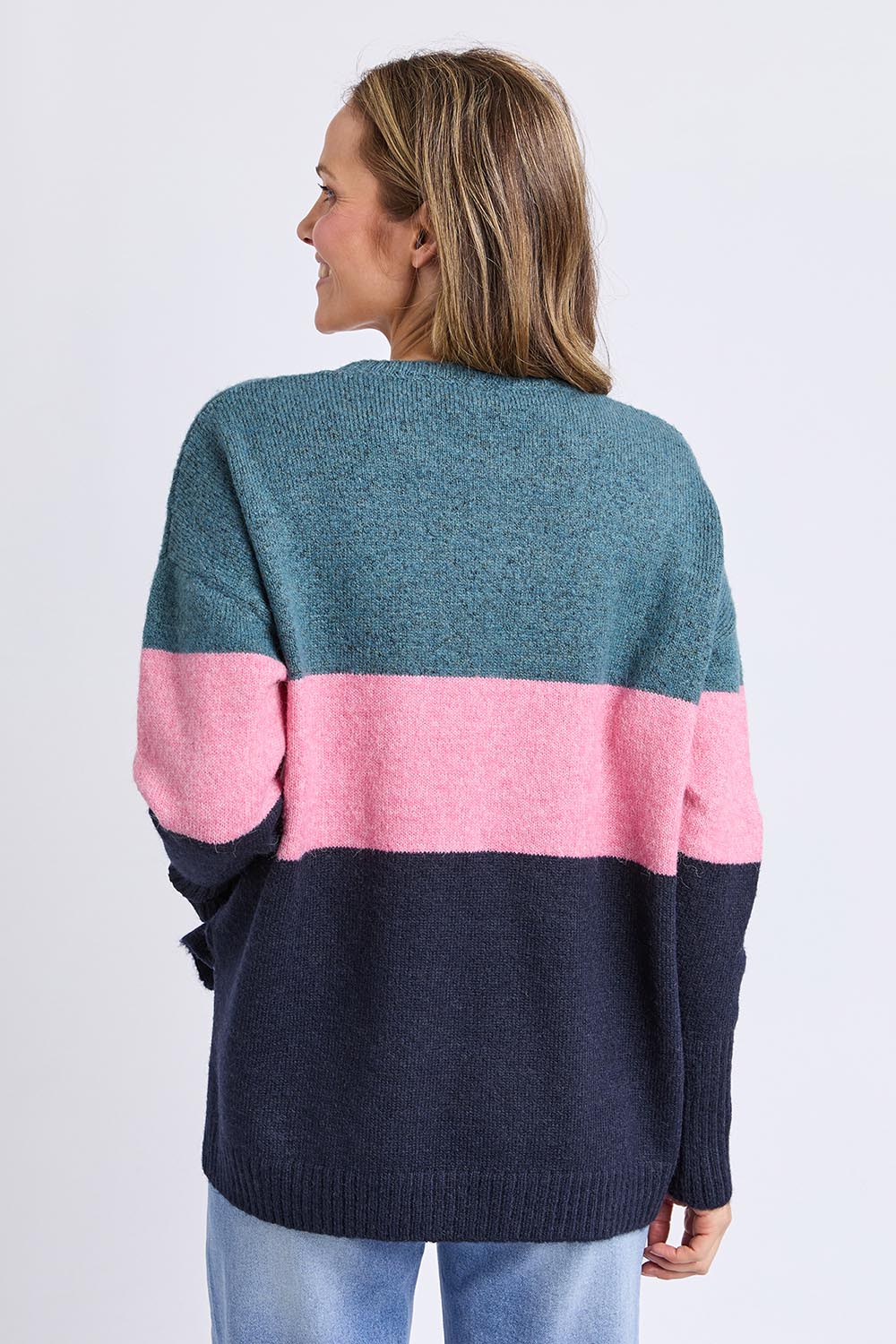 A model wearing the Cory Stripe Knit in colour Multi, from the back