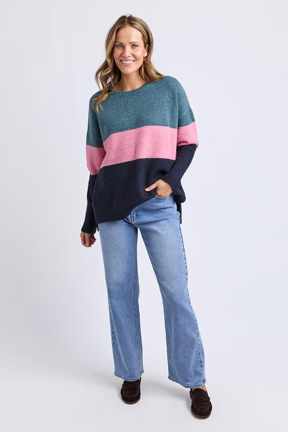 A model wearing the Cory Stripe Knit in colour Multi, from the front, showing the whole outfit