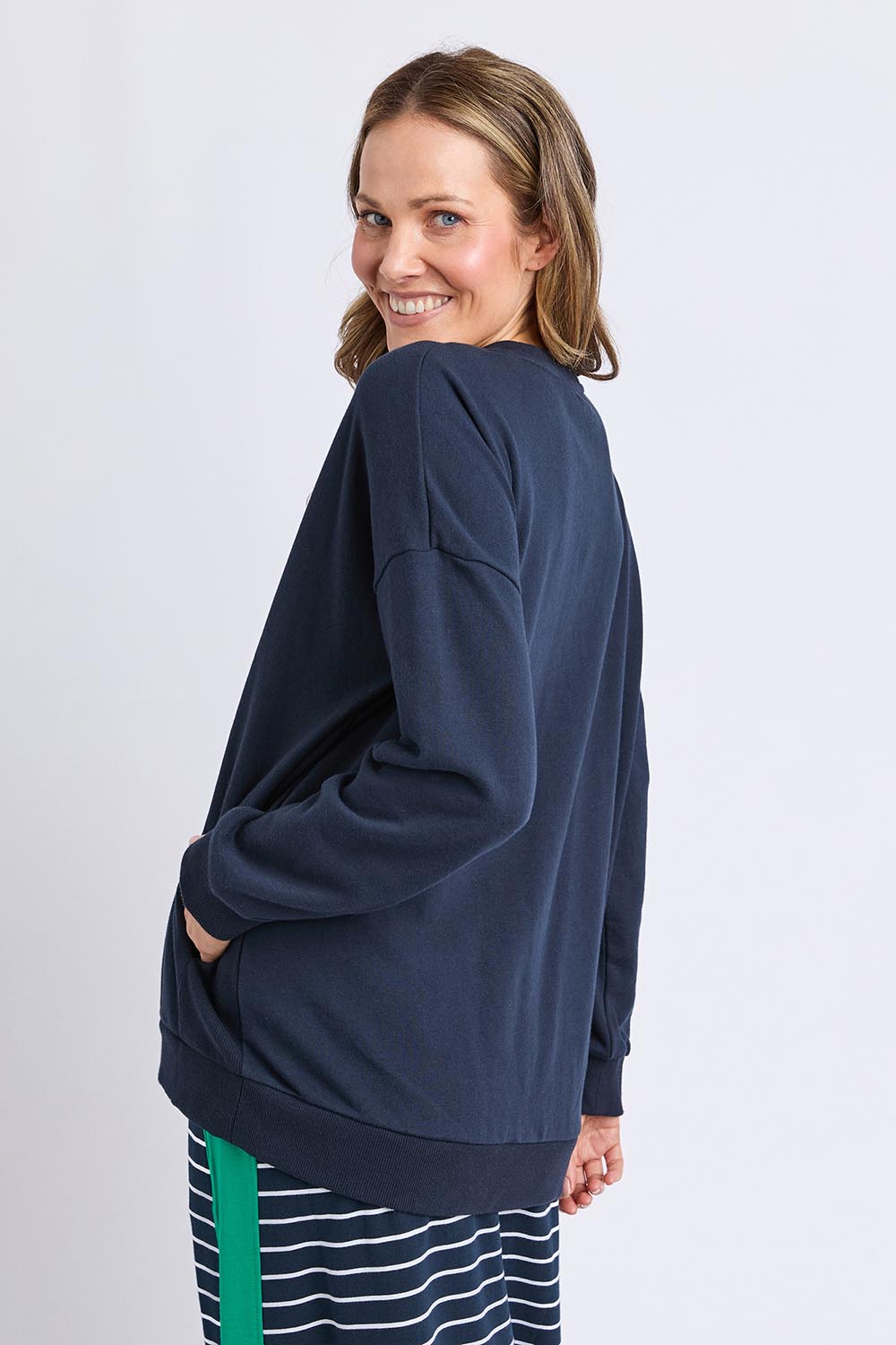 A model wearing the Cetara Crew in colour Navy (Blue), from the back