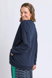 A model wearing the Cetara Crew in colour Navy (Blue), from the back
