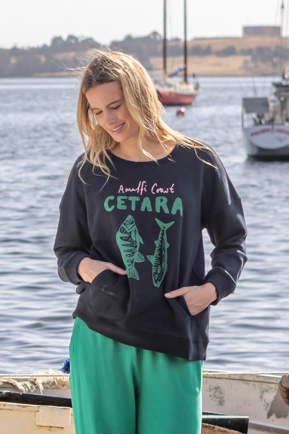 A model wearing the Cetara Crew in colour Navy (Blue), from the front, showing the whole outfit