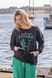 A model wearing the Cetara Crew in colour Navy (Blue), from the front, showing the whole outfit