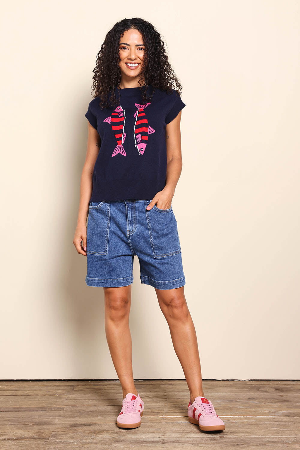 Model Pamelar wearing size 10 of the Fishy Intersia Vest – Chinablue in colour Chinablue, from the front