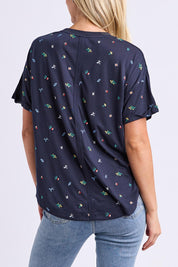 Model Genericm wearing size sample of the Festive Market Tee – Navy in colour Navy, from the back