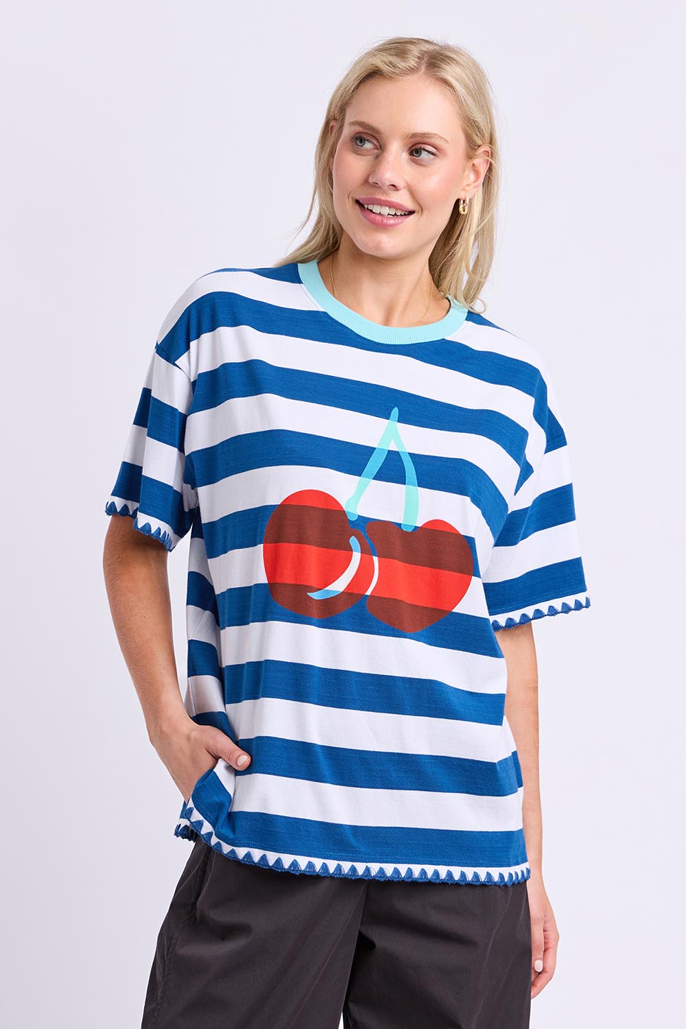 Model Genericm wearing size sample of the Cherry Cotton Tee – Chinablue in colour Chinablue, in a cropped view