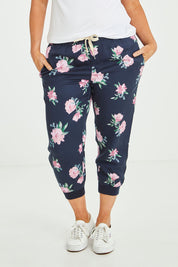 Model Laura wearing size 14 of the Primrose Pant in colour Navy (Blue), from the front, cropped image