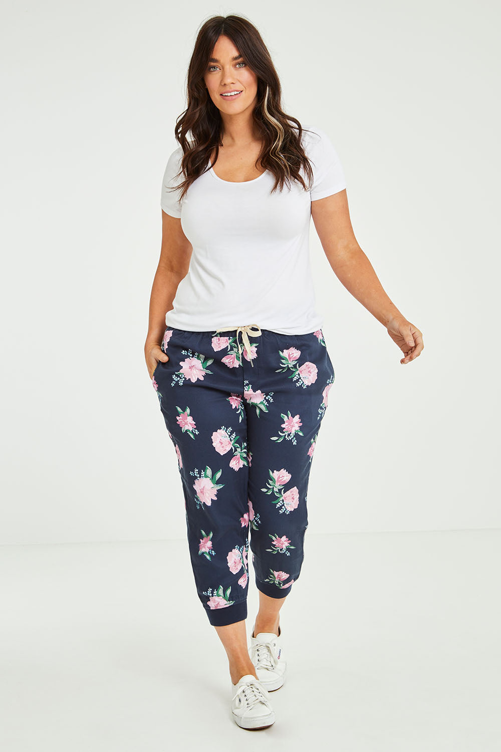 Model Laura wearing size 14 of the Primrose Pant in colour Navy (Blue), from the front, showing the whole outfit