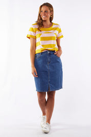 A model wearing the Chloe Denim Skirt in colour Midblue (Blue), from the front, showing the whole outfit