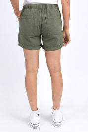 Model Genericm wearing size sample of the Fundamental Emma Relaxed Denim Short – Clover in colour Clover, from the front