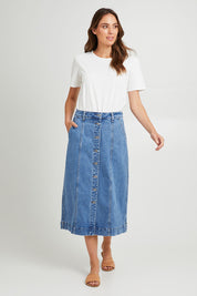 Model Madeline wearing size 10 of the Florence Button Through Skirt in colour Midblue (Blue), from the front, showing the whole outfit