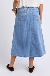 A model wearing the Scallop Edge Denim Skirt in colour Lightblue (Blue), from the back