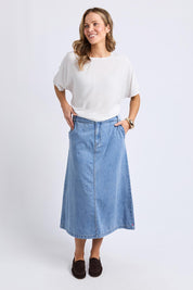 A model wearing the Scallop Edge Denim Skirt in colour Lightblue (Blue), from the front, showing the whole outfit