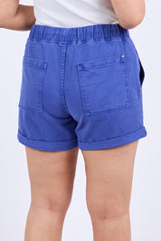A model wearing the Emma Relaxed Denim Short in colour Oceanblue (Blue), from the back