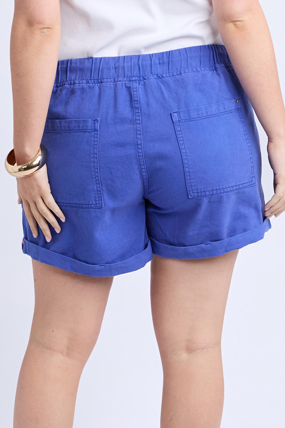 A model wearing the Emma Relaxed Denim Short in colour Oceanblue (Blue), from the back