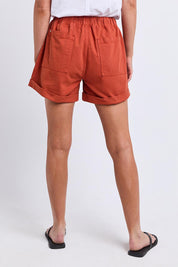 Model Genericm wearing size sample of the Fundamental Emma Relaxed Denim Short – Earthbrown in colour Earthbrown, from the back