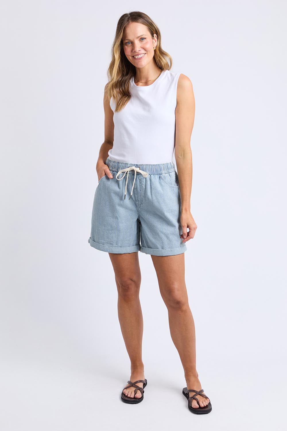 A model wearing the Holli Stripe Denim Short in colour Bluewhite (Blue), from the front, showing the whole outfit