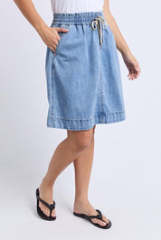 A model wearing the Paisley Denim Skirt in colour Lightblue (Blue), from the front, cropped image