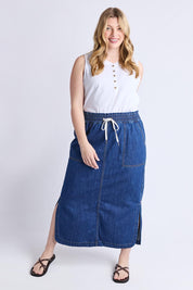 A model wearing the Clover Midi Denim Skirt in colour Midblue (Blue), from the front, showing the whole outfit