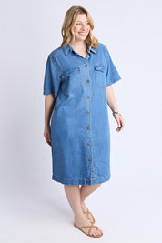 A model wearing the Cora Denim Lyocell Blend Dress in colour Misblue (Blue), from the front, showing the whole outfit