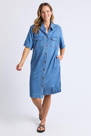 A model wearing the Cora Denim Lyocell Blend Dress in colour Misblue (Blue), from the front, showing the whole outfit
