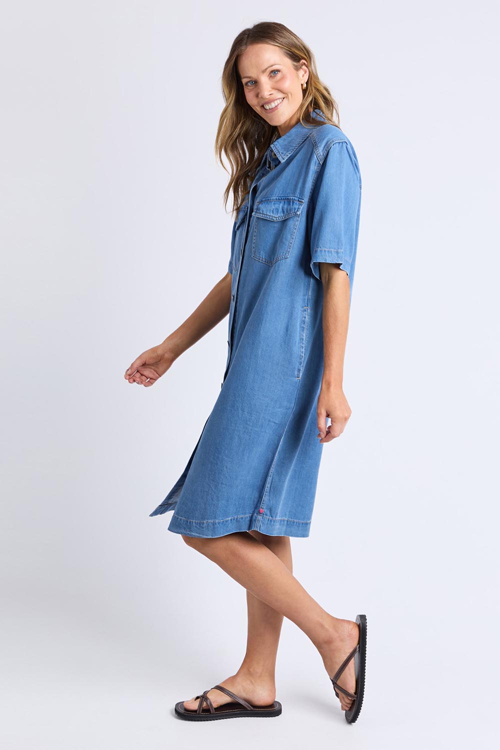 A model wearing the Cora Denim Lyocell Blend Dress in colour Misblue (Blue), from the front, showing the whole outfit