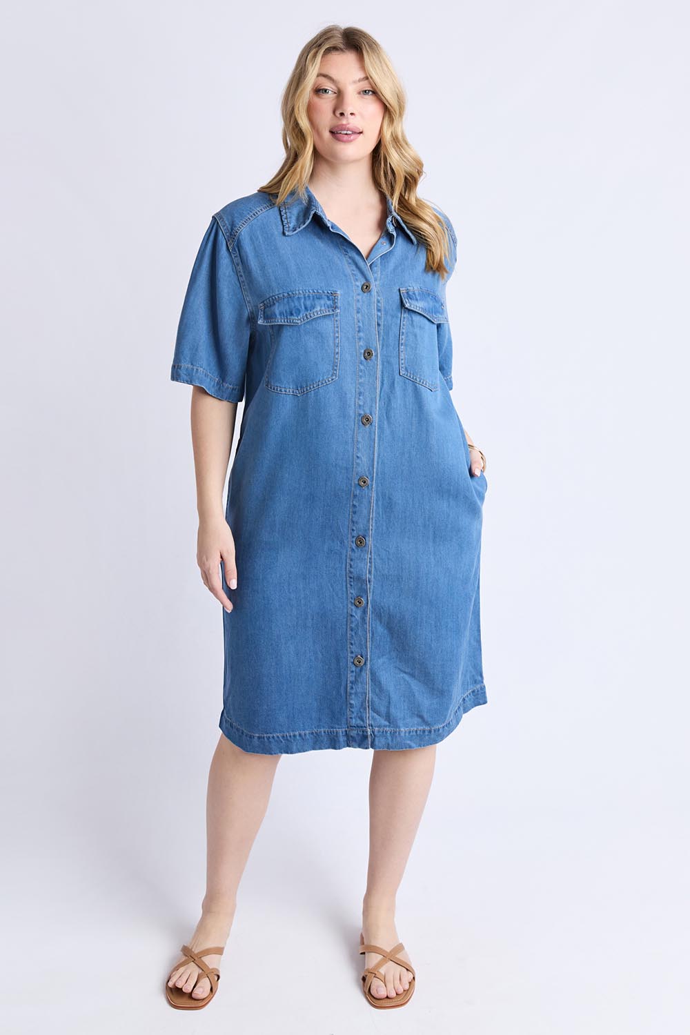 A model wearing the Cora Denim Lyocell Blend Dress in colour Misblue (Blue), from the front, showing the whole outfit
