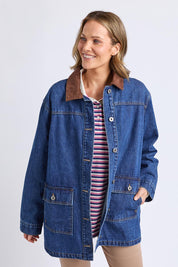 A model wearing the Lilian Denim Barn Jacket in colour Midblue (Blue), from the front, cropped image