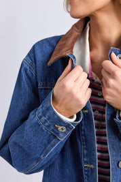A model wearing the Lilian Denim Barn Jacket in colour Midblue (Blue), from the front, cropped image