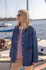 A model wearing the Lilian Denim Barn Jacket in colour Midblue (Blue), from the front, showing the whole outfit