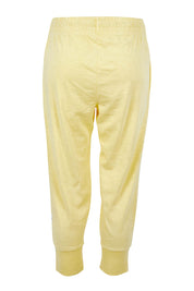 Product shot of the Fundamental Brunch Cotton Pant in colour Banana, from the back