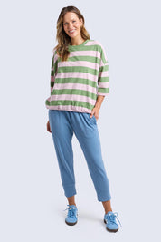 A model wearing the Fundamental Brunch Cotton Pant in colour Blueshadow (Blue), from the front, showing the whole outfit