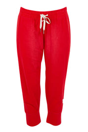 Product shot of the Fundamental Brunch Cotton Pant in colour Cranberry (Red), from the front
