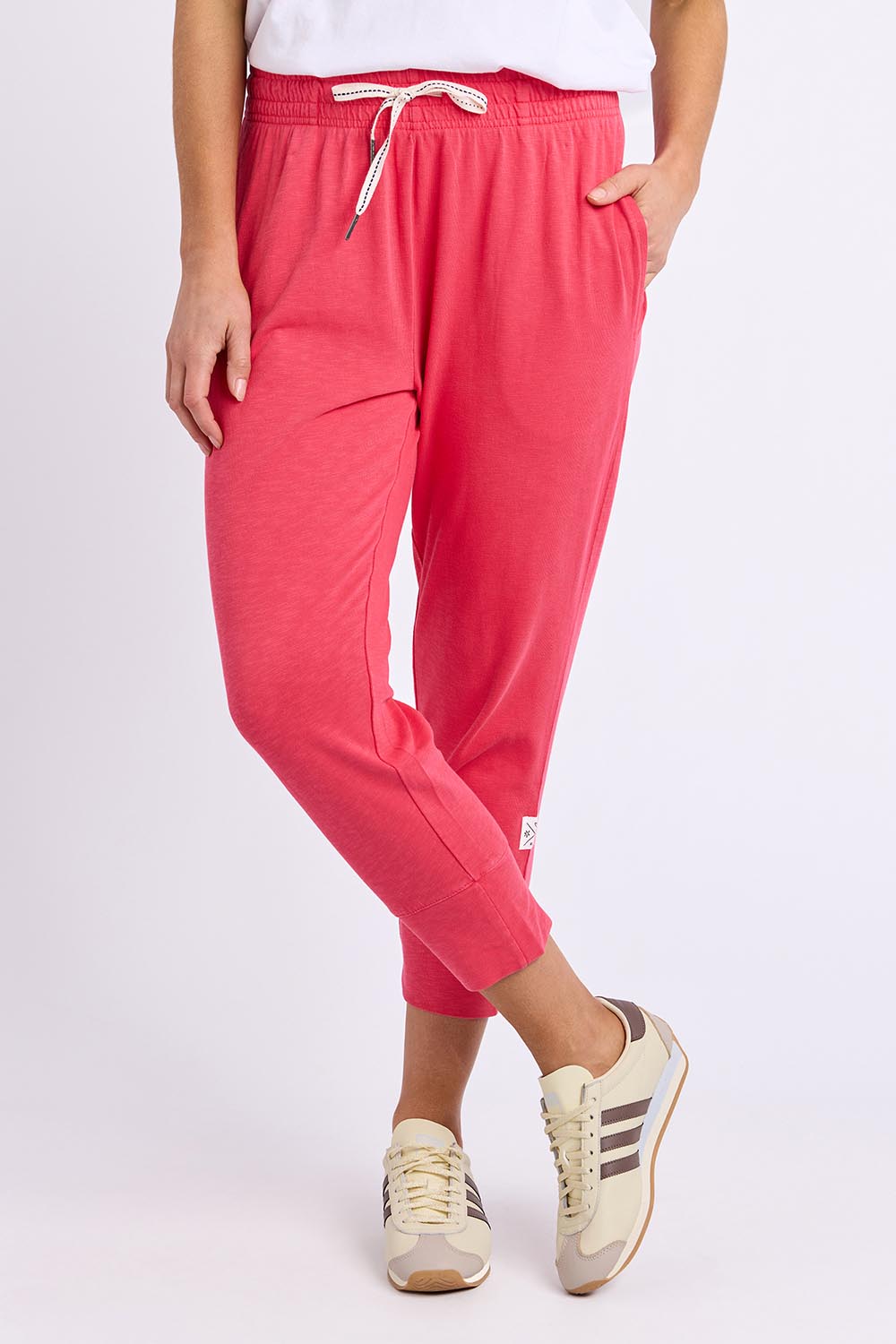 Model Genericm wearing size sample of the Fundamental Brunch Pant – Darkpink in colour Darkpink, in a cropped view