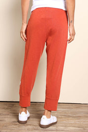 Model Pamelar wearing size 10 of the Fundamental Brunch Cotton Pant – Earthbrown in colour Earthbrown, from the back