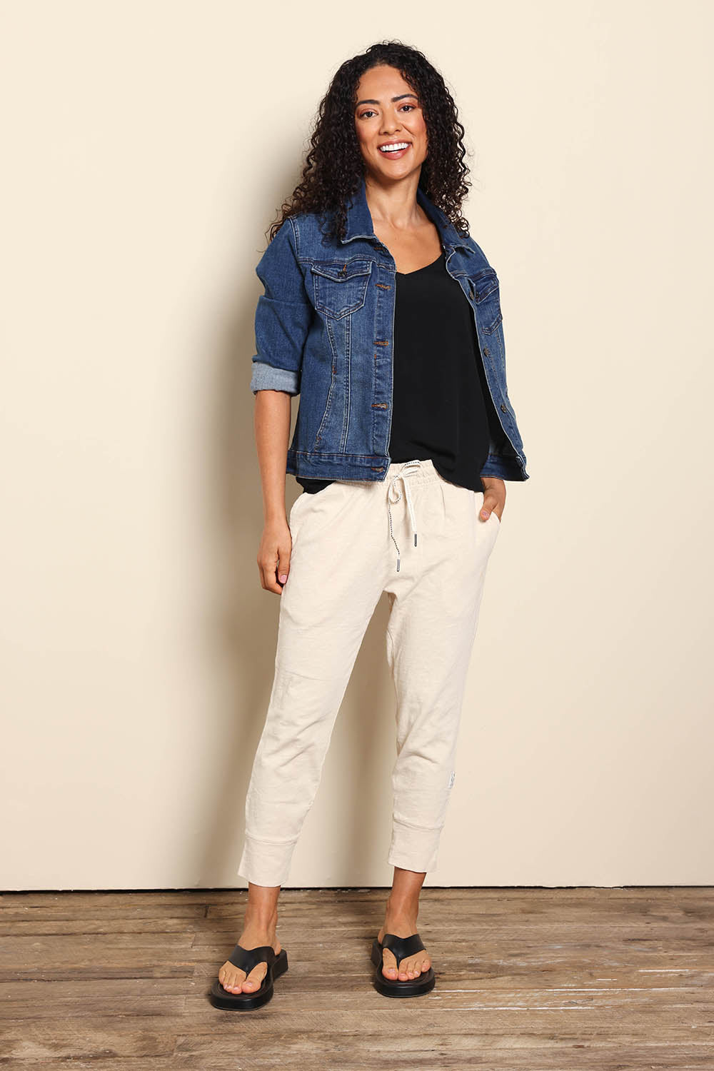 Model Pamelar wearing size 10 of the Fundamental Brunch Cotton Pant - Linen in colour Linen, from the front