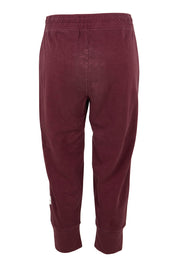 Product shot of the Fundamental Brunch Cotton Pant in colour Merlot (Red), from the back