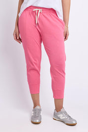 Model Genericm wearing size sample of the Fundamental Brunch Cotton Pant – Pinklemon in colour Pinklemon, in a cropped view