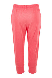 Product shot of the Fundamental Brunch Cotton Pant in colour Watermelon (Red), from the back