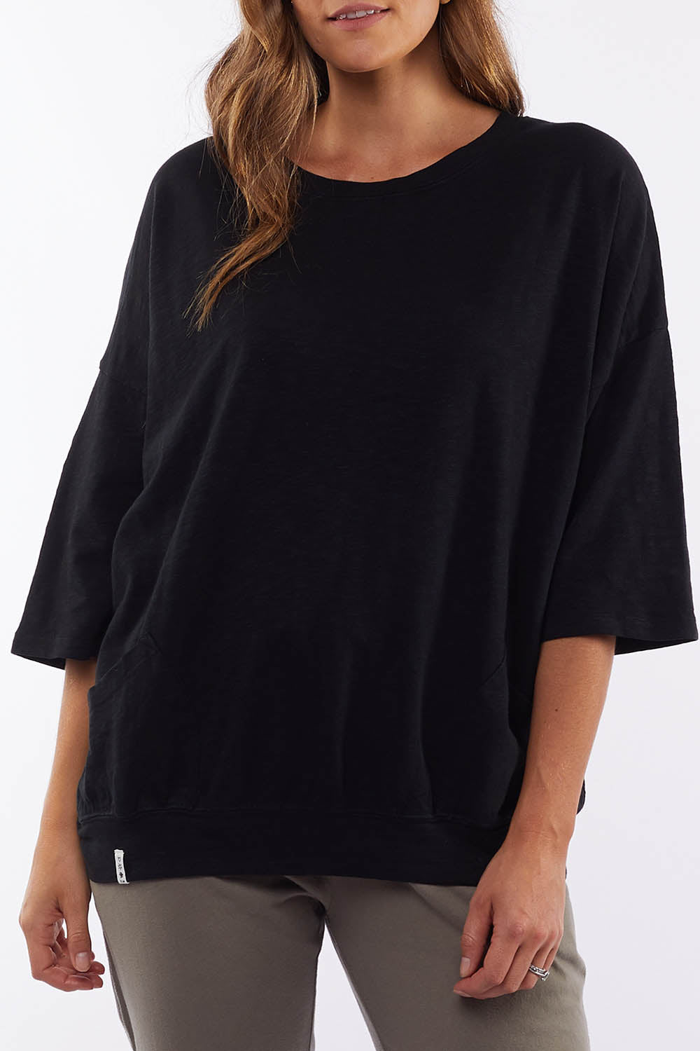 A model wearing the Fundamental Mazie Cotton Sweat Top in colour Black (Black), from the front, cropped image