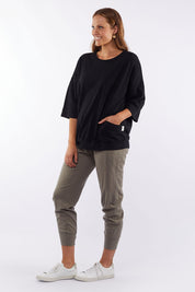 A model wearing the Fundamental Mazie Cotton Sweat Top in colour Black (Black), from the front, showing the whole outfit