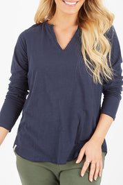 Model Hayley wearing size 10 of the Fundamental Coles Bay Henley in colour Navy (Blue), from the front, cropped image